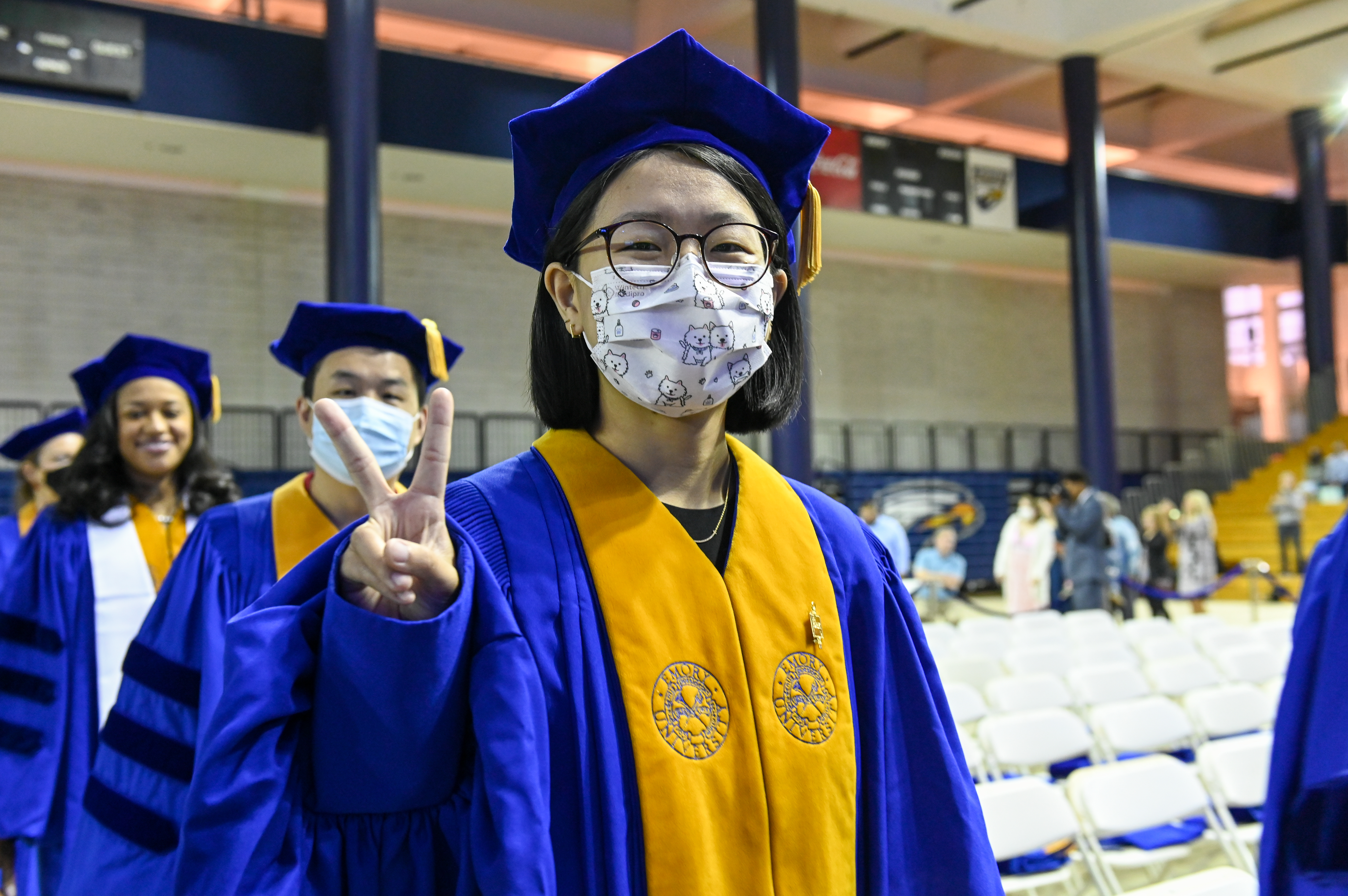 graduate wearing mask smiling 